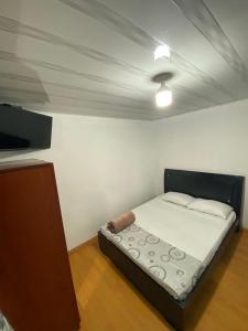Postel nebo postele na pokoji v ubytování Hostal Casa Primavera