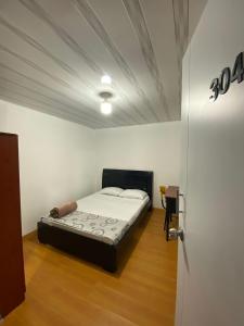 Postel nebo postele na pokoji v ubytování Hostal Casa Primavera
