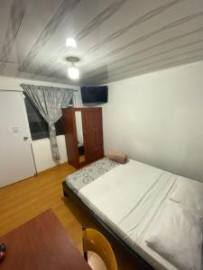 Postel nebo postele na pokoji v ubytování Hostal Casa Primavera