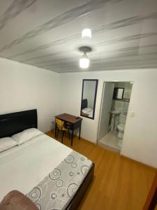 Postel nebo postele na pokoji v ubytování Hostal Casa Primavera