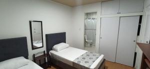 Postel nebo postele na pokoji v ubytování Hostal Casa Primavera