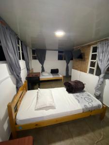 Postel nebo postele na pokoji v ubytování Hostal Casa Primavera