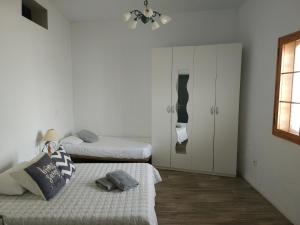 Postel nebo postele na pokoji v ubytování Villa de Ingenio JAVAZU