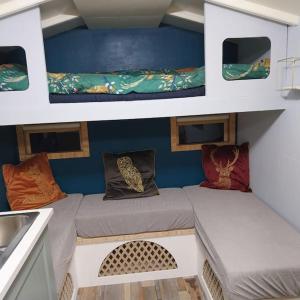 a room with two beds on a boat at Tiny home OR Chalet - with toilet & shower room in separate outbuilding in Nottingham