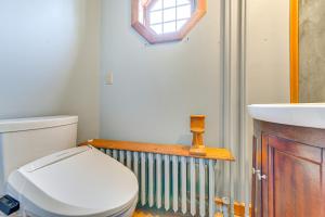 a bathroom with a toilet and a sink at Saratoga Springs Home with Hot Tub Walk to Downtown in Saratoga Springs +23 photos