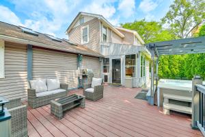 a house with a deck with a tub and a bench at Saratoga Springs Home with Hot Tub Walk to Downtown in Saratoga Springs