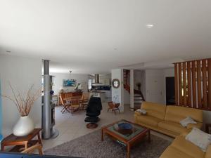 a living room with a couch and a table at ty koz in Erdeven