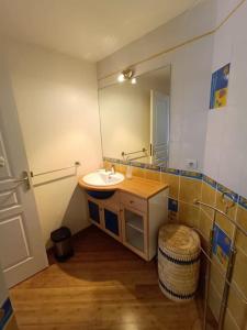 a bathroom with a sink and a mirror at ty koz in Erdeven +39 photos