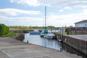 a group of boats are docked in a marina at Secluded Sanctuary On The River in Christchurch