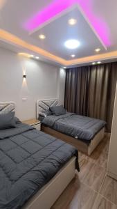 Postel nebo postele na pokoji v ubytování شقه للايجار في مدينتي b6 Al00