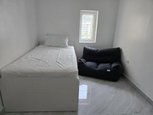 Ένα ή περισσότερα κρεβάτια σε δωμάτιο στο Yuya's sweet Condo suite