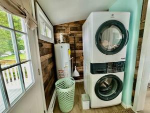 a washer and dryer in a room with a window at Miami Beach Villas NJ Loft Style Cottage in Villas