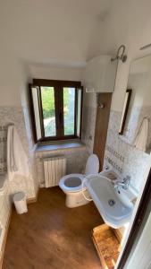 a bathroom with a toilet and a sink at B&B La Majella Me in Abbateggio +23 photos