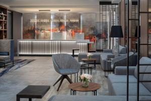 a lobby with couches and chairs and a bar at Fairfield Inn & Suites by Marriott New York Staten Island in Staten Island