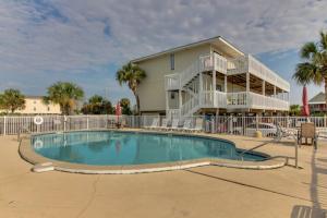 a swimming pool in front of a house at Moonraker 35 in Gulf Shores