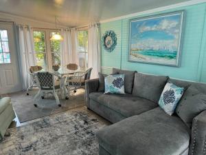 a living room with a couch and a table at Venice Bungalow in Venice