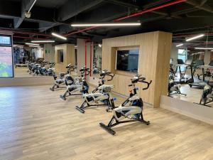 a gym with rows of cardio exercise bikes at Best Choice Poblado Suite and Breakfast in Medellín