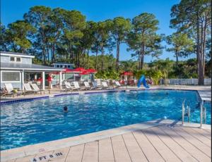 a swimming pool with a person in the water at Venice Bungalow in Venice