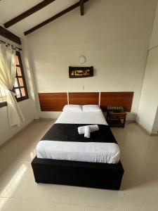 Voodi või voodid majutusasutuse HOTEl OTUN PLAZA PEREIRA toas