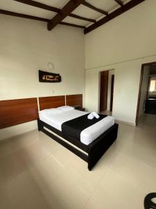 Voodi või voodid majutusasutuse HOTEl OTUN PLAZA PEREIRA toas