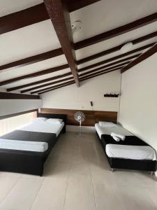 Voodi või voodid majutusasutuse HOTEl OTUN PLAZA PEREIRA toas