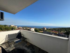 a balcony with a view of the ocean at Apartmani MILIC in Kotor