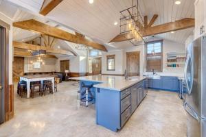 a large kitchen with blue cabinets and blue countertops at Double Shotz in Concan
