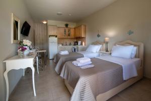 A bed or beds in a room at Melograno Apartments and Studios