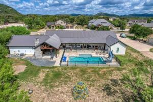 an aerial view of a house with a swimming pool at River Ridge in Concan