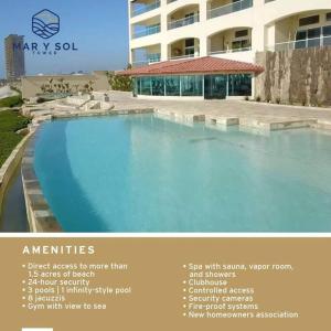 a picture of a swimming pool in front of a building at BEACH FRONT CONDO, PRIVATE BEACH and AMAZING VIEWS!! in Los Cuatro Hermanos