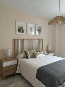 En eller flere senge i et værelse på Apartamento RondaSueña Centro