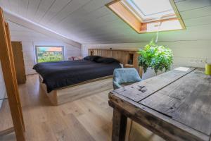 Ένα ή περισσότερα κρεβάτια σε δωμάτιο στο Lodge Terre de Glisse +31 φωτογραφίες