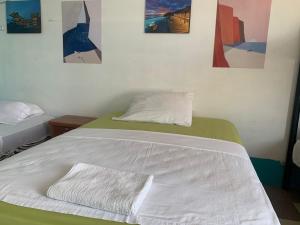 Postel nebo postele na pokoji v ubytování Hostal El Naufrago 2