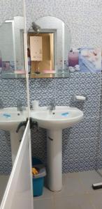a bathroom with a sink and a mirror at Yacoubi in Oued Laou +9 photos