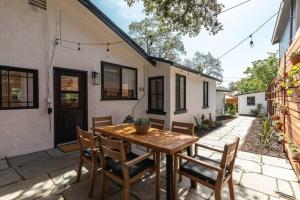 a patio with a wooden table and chairs at Casita Monterey Pet-Friendly Sonoma Escape in Sonoma