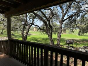 a porch with a view of a horse in a field at Casita on the Ranch 2 in Spring Branch