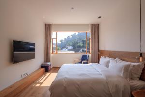 Hangzhou Moju Boutique Guesthouse at the West Lake客房内的一张或多张床位