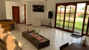 a living room with a couch and a table at Casa Grande de Campo en Huachipa in Lima