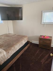 Postel nebo postele na pokoji v ubytování Magnolia APT 2