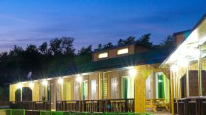 a house with lights on it at night at Suncheon Bay Wind Hill House in Suncheon +2 photos
