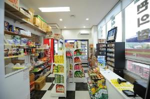 a store aisle of a grocery store with food at Yeosu Court Pension in Yeosu