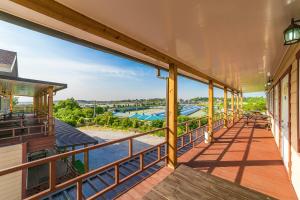 a balcony with a view of a swimming pool at Nonsan Sodam Pension in Nonsan