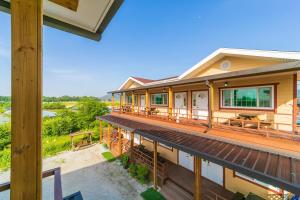 an overhead view of a house with a deck at Nonsan Sodam Pension in Nonsan