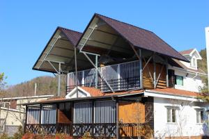 a house with balconies on top of it at Moojoo Jeonmangdae Pension in Muju +9 photos