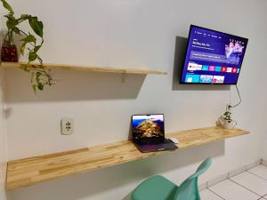 TV a/nebo společenská místnost v ubytování Apartamento INTEIRO próximo ao Aeroporto