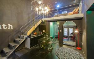 a room with a staircase and a room with a table at Chuncheon Pier Star Pension in Chuncheon