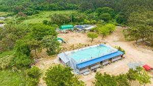 an overhead view of a swimming pool in a park at Bakripo Badawa Padosori Camping pension in Taean