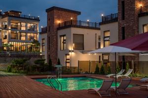 a swimming pool in front of a building at Cheongdo Casa Loma Pool Villa in Cheongdo
