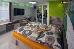 Ένα ή περισσότερα κρεβάτια σε δωμάτιο στο Designpension Idyll Nr2 Hotel Garni