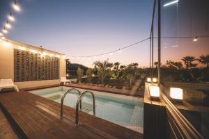 a house with a swimming pool and a deck at Jeju Page672 in Seogwipo